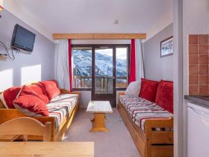 a living room with two couches and a window at Studio Avoriaz, 1 pièce, 4 personnes - FR-1-314-273 in Morzine