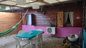 a room with a table and a sink and a person in a mirror at PIEDRAS PRECIOSAS in Villa Gesell