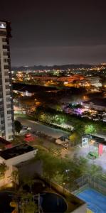 a view of a city at night with a building at Al Mansor Islamic Guestroom in Seremban
