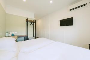 Postel nebo postele na pokoji v ubytování The Concept Hotel Melaka City