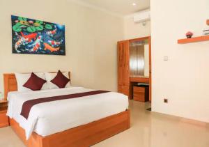 Postel nebo postele na pokoji v ubytování Wayan House Seminyak