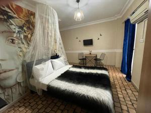 a bedroom with a bed with a mosquito net at Terrace Boutique Otel in Serdivan