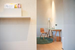 a dining room with a table and two chairs at Read and Rest Hotel in Beijing