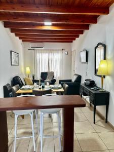 a living room with a couch and a table at Sol y Vida in Godoy Cruz +25 photos