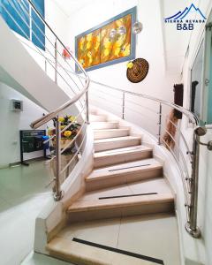 a staircase in a building with a painting on the wall at Hotel Sierra Nevada B&B SAS in Valledupar