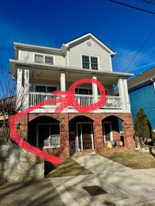 a house with a red peace sign in front of it at Holiday Room with Private Bathroom in ATL, Summerhill, Stairs Required in Atlanta