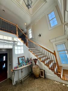 a room with a staircase and a vase on the floor at Holiday Room with Private Bathroom in ATL, Summerhill, Stairs Required in Atlanta