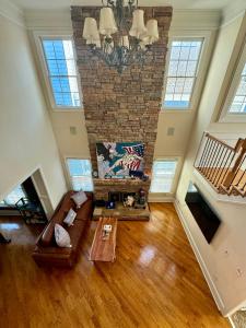 an overhead view of a living room with a brick wall at Holiday Room with Private Bathroom in ATL, Summerhill, Stairs Required in Atlanta