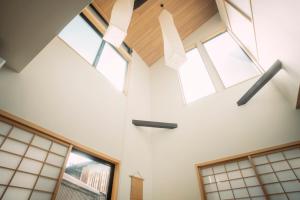 a room with windows and a ceiling with skylights at 谷町君 星屋 樨ノ宿 清水寺 in Kyoto +92 photos
