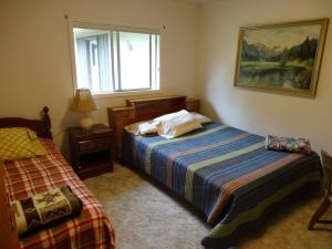 Postel nebo postele na pokoji v ubytování Dunes Coastal Getaway + 8 fotografií