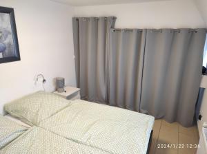 a bedroom with a bed and a shower curtain at Pferdehof Jäger in Markranstädt