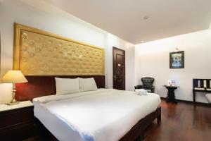 Postelja oz. postelje v sobi nastanitve Ha Noi Memory Central Hotel And Spa