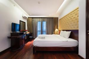 Postelja oz. postelje v sobi nastanitve Ha Noi Memory Central Hotel And Spa