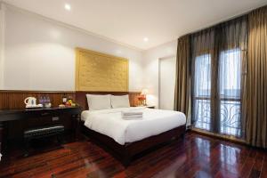 Giường trong phòng chung tại Ha Noi Memory Central Hotel And Spa