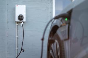 a car is hooked up to a wall with a wire at Vogar Travel Service in Myvatn