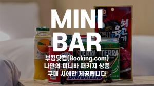 a drink and a can of mint bar on a table at Nine Tree Premier Hotel Insadong in Seoul