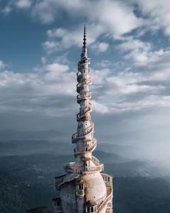 a tall building on top of a mountain at SHADEY COTTAGE in Gampola