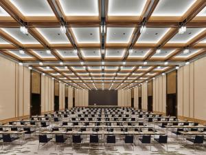an empty lecture hall with chairs and a stage at Banyan Tree Dongguan Songshan Lake in Dongguan