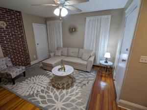 a living room with a couch and a table at Providence Place Apartment in Providence