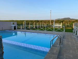 a large swimming pool with blue water at THE AVID HOTEL in Voi