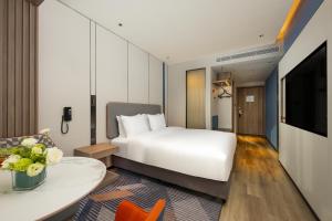 เตียงในห้องที่ Holiday Inn Express Hefei FTZ, an IHG Hotel