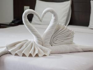 Postel nebo postele na pokoji v ubytování Nirwana Resort