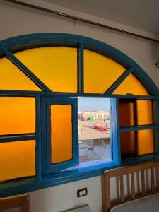 a window with a view of a building at Fresh studio in Dahab in Dahab
