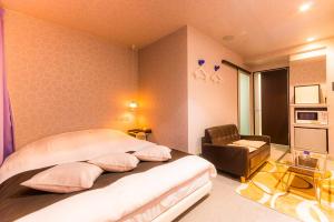 Voodi või voodid majutusasutuse ホテルR-Adult only-lovehotel toas