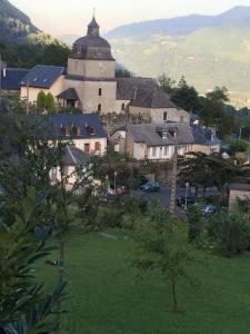 a small town with a large building and a church at Le Belvedere in Salles