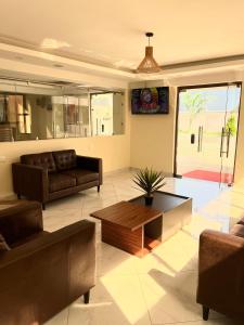 a living room with a couch and a coffee table at THE AVID HOTEL in Voi