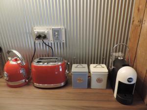 a group of appliances sitting on a wooden floor at Gardenhouse on George in Burra