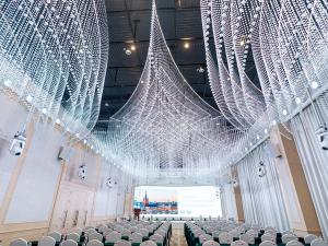 a large room with white nets hanging from the ceiling at Vienna International Hotel Hengyang Huayao city in Hengyang