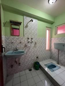 a bathroom with a sink and a shower and a toilet at Hotel Sweet Dreams thamel kathmandu in Kathmandu