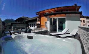 a bath tub on a balcony of a house at Albergo Alla Torre in Caldonazzo