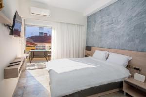 Ένα ή περισσότερα κρεβάτια σε δωμάτιο στο Old Town Apartment 2