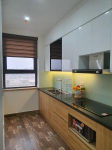 A kitchen or kitchenette at Bach Dang Apartment Hai Duong