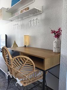 a wooden desk with a chair in a room at Sunny holidays in Santa Pola in Santa Pola +12 photos