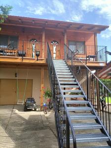 a staircase leading up to a house with a balcony at Ubytovanie Pepo in Štúrovo