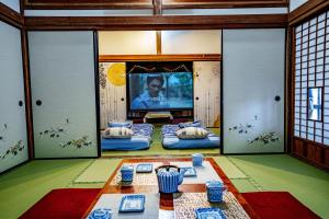 מיטה או מיטות בחדר ב-一宿一景一生縁-千葉県市原市小谷田店