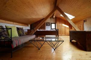 a living room with a couch and a table at Wild Valley Puro Ticino 1+2 in Valle Onsernone in Crana +13 photos