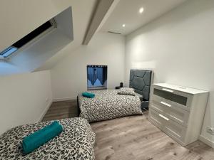 Ένα ή περισσότερα κρεβάτια σε δωμάτιο στο Comme a la maison 6