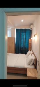 Postel nebo postele na pokoji v ubytování Hotel Fama