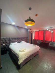 Postel nebo postele na pokoji v ubytování Hotel Fama