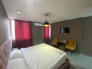 Postel nebo postele na pokoji v ubytování Hotel Fama