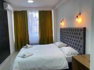 Postel nebo postele na pokoji v ubytování Hotel Fama