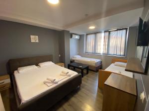 Postel nebo postele na pokoji v ubytování Hotel Fama