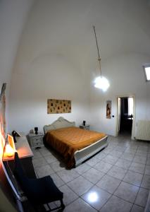 מיטה או מיטות בחדר ב-Origini - Apartment with private Garden
