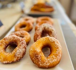 a group of donuts sitting on top of a tray at Stomio Villague in Filiatra