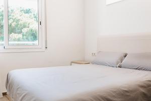 Postel nebo postele na pokoji v ubytování Hauzify I Apartament Arroyo