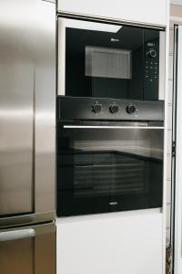 Kuchyň nebo kuchyňský kout v ubytování Hauzify I Apartament Arroyo